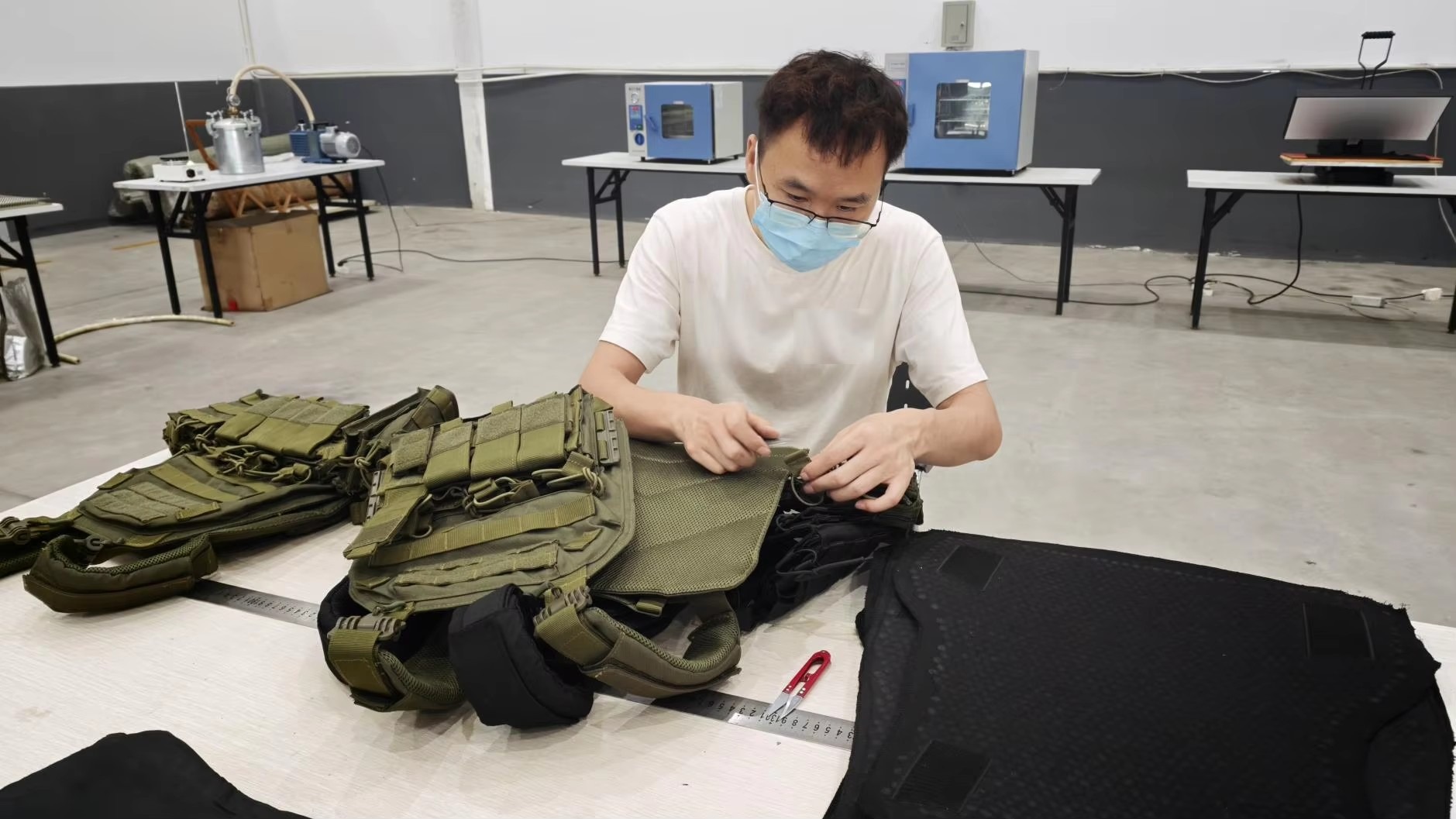 Protective garments being inspected